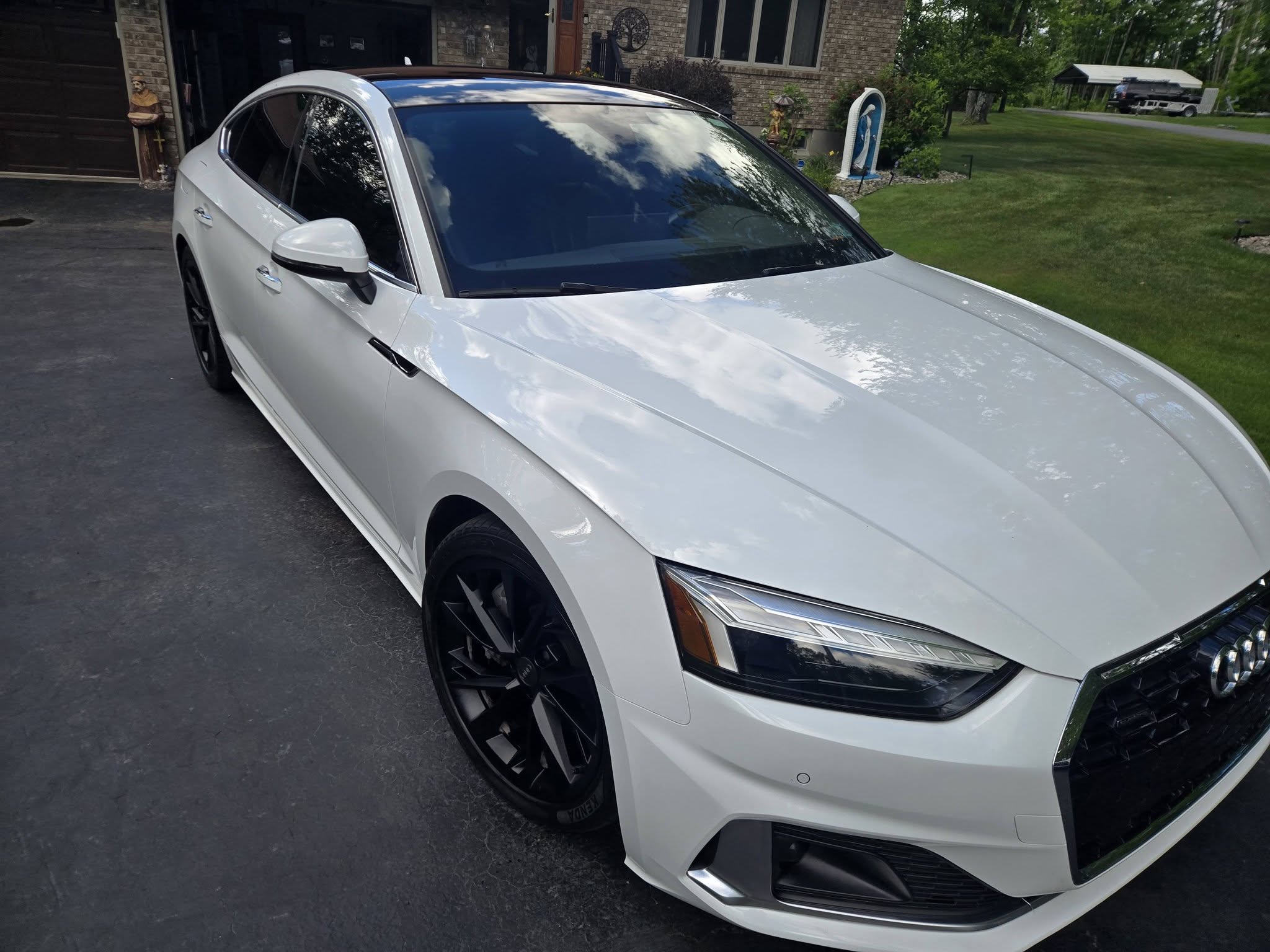 White Audi A5 detailed to a wet, reflective shine