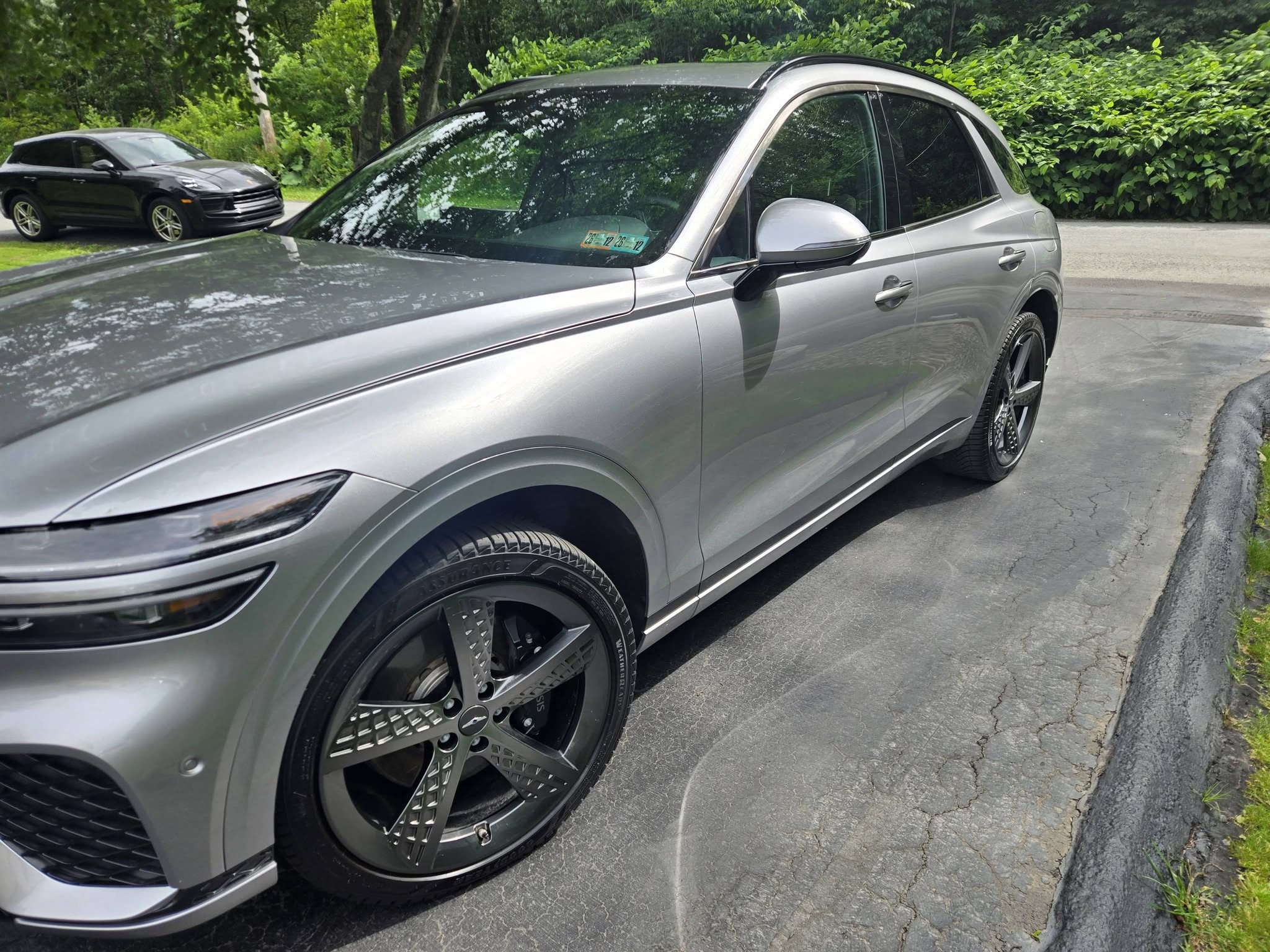 Silver Genesis GV70 SUV with a deep, glossy finish