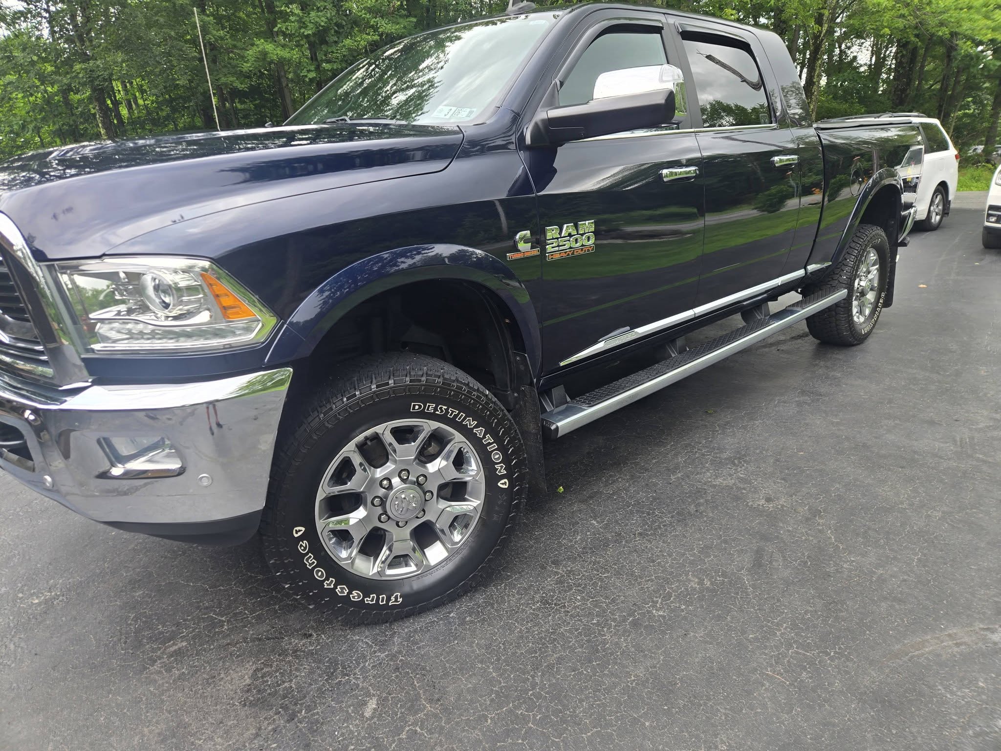 Navy Ram 2500 heavy duty truck with a mirror shine